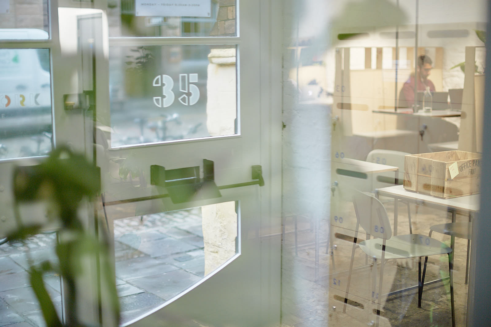 Planting against glazed partitions inside the workspace