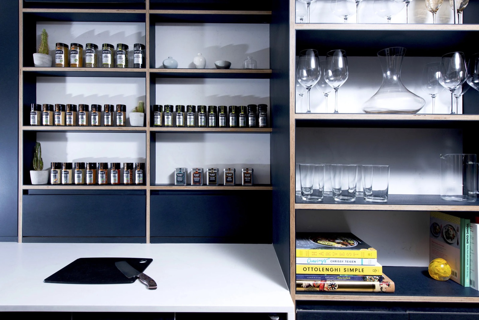 The steel framed shelving unit with its jars and boards