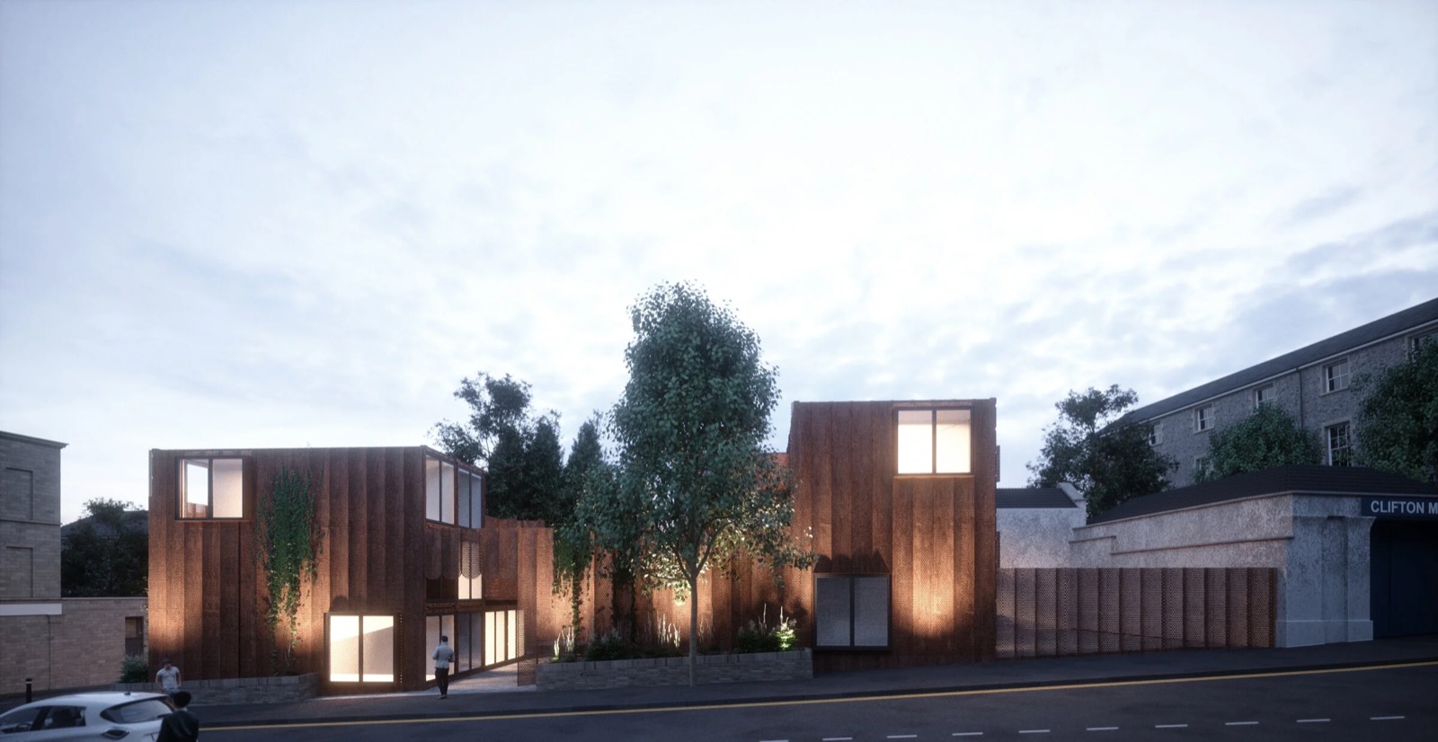 The dark clad studio building at night, rendered view