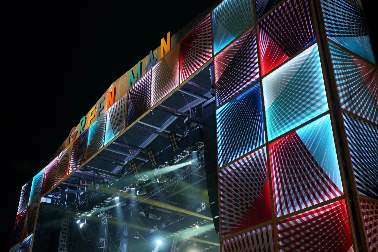 The ribbon panels lit from within at night