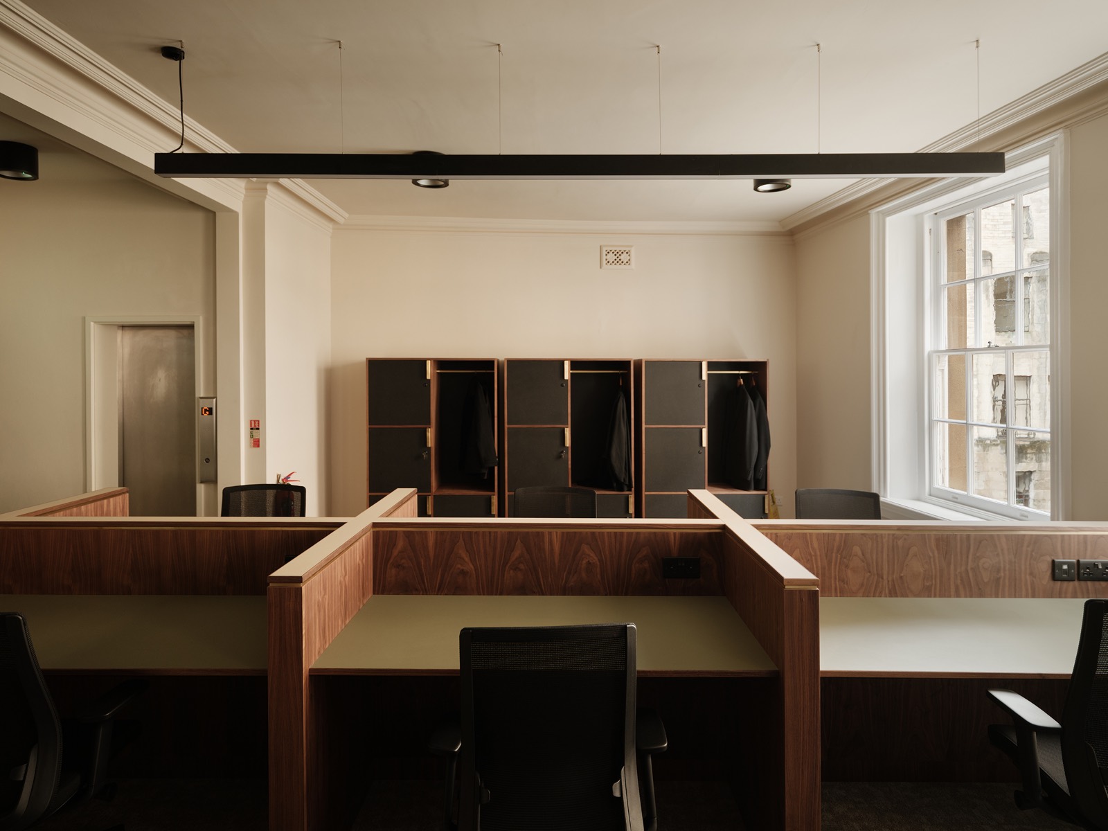 Walnut desk booths in the co working office