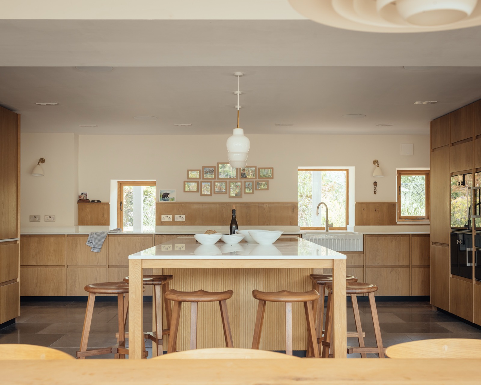 The new kitchen with a pale timber island