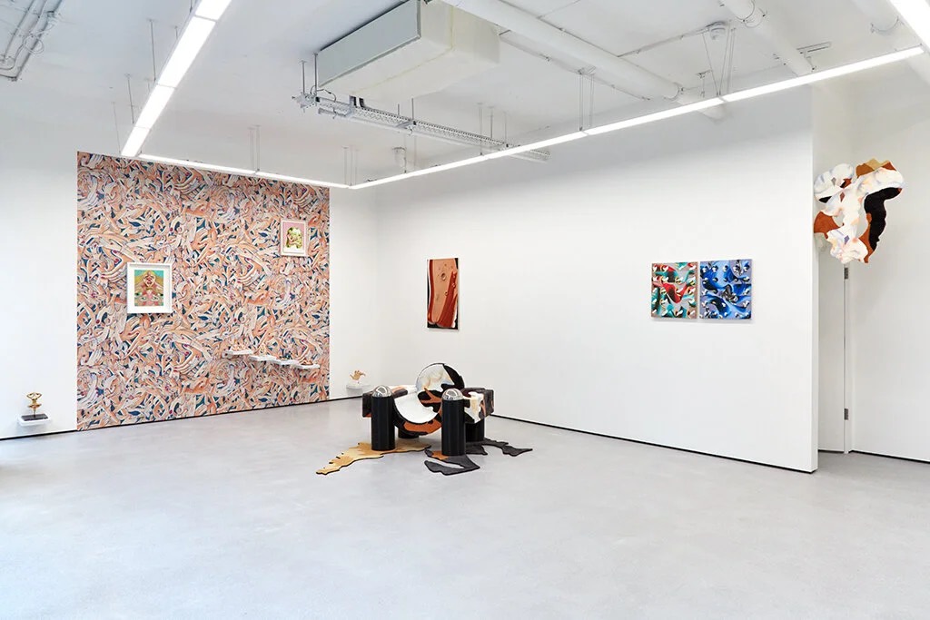 The gallery with white walls against the brick shell