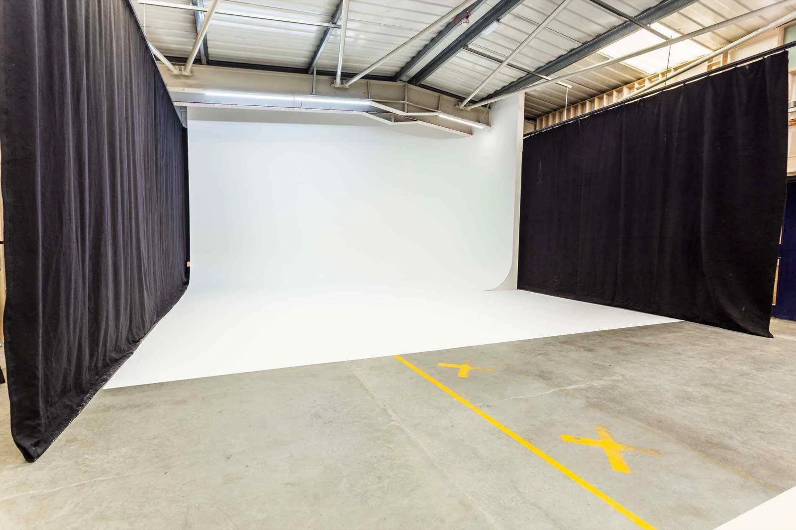 A studio space with blackout curtains