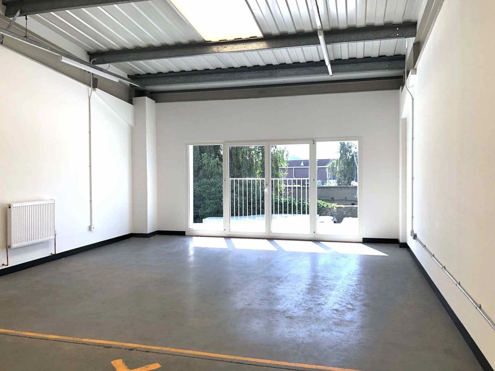 The white studio with its glazing