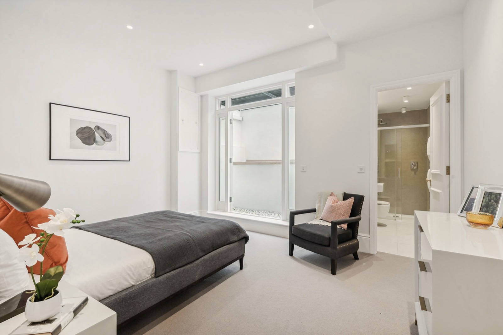 The basement bedroom and en-suite, glazed to the front lightwell