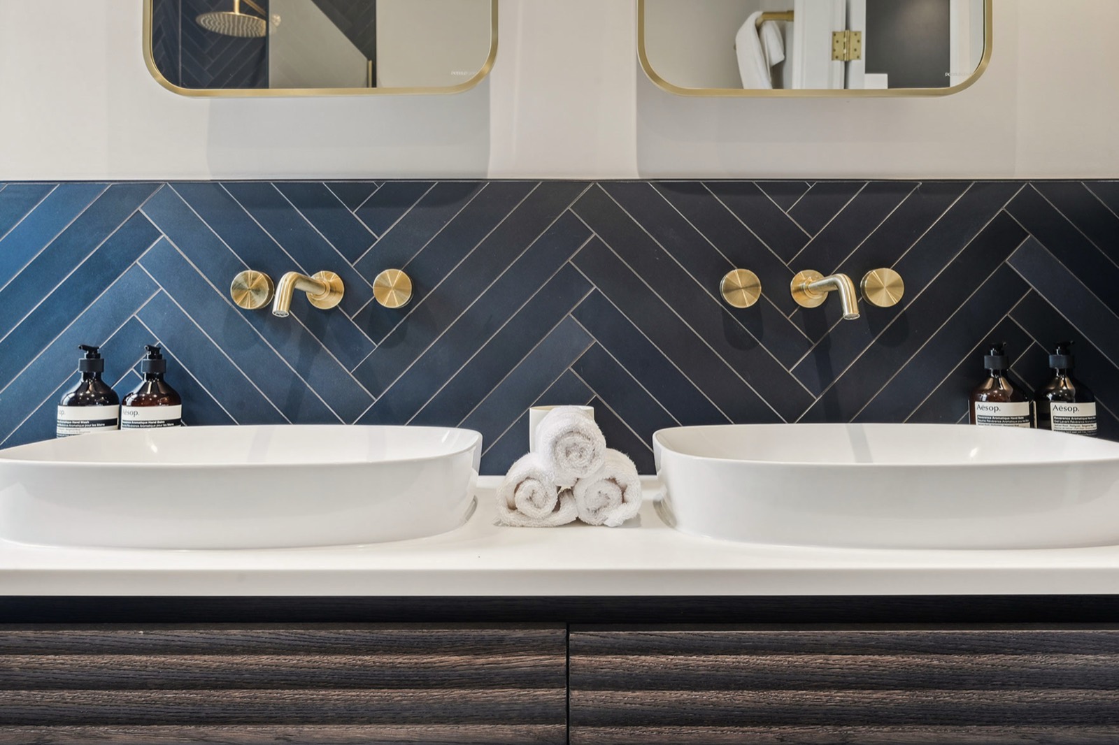 Twin basins against herringbone tiling