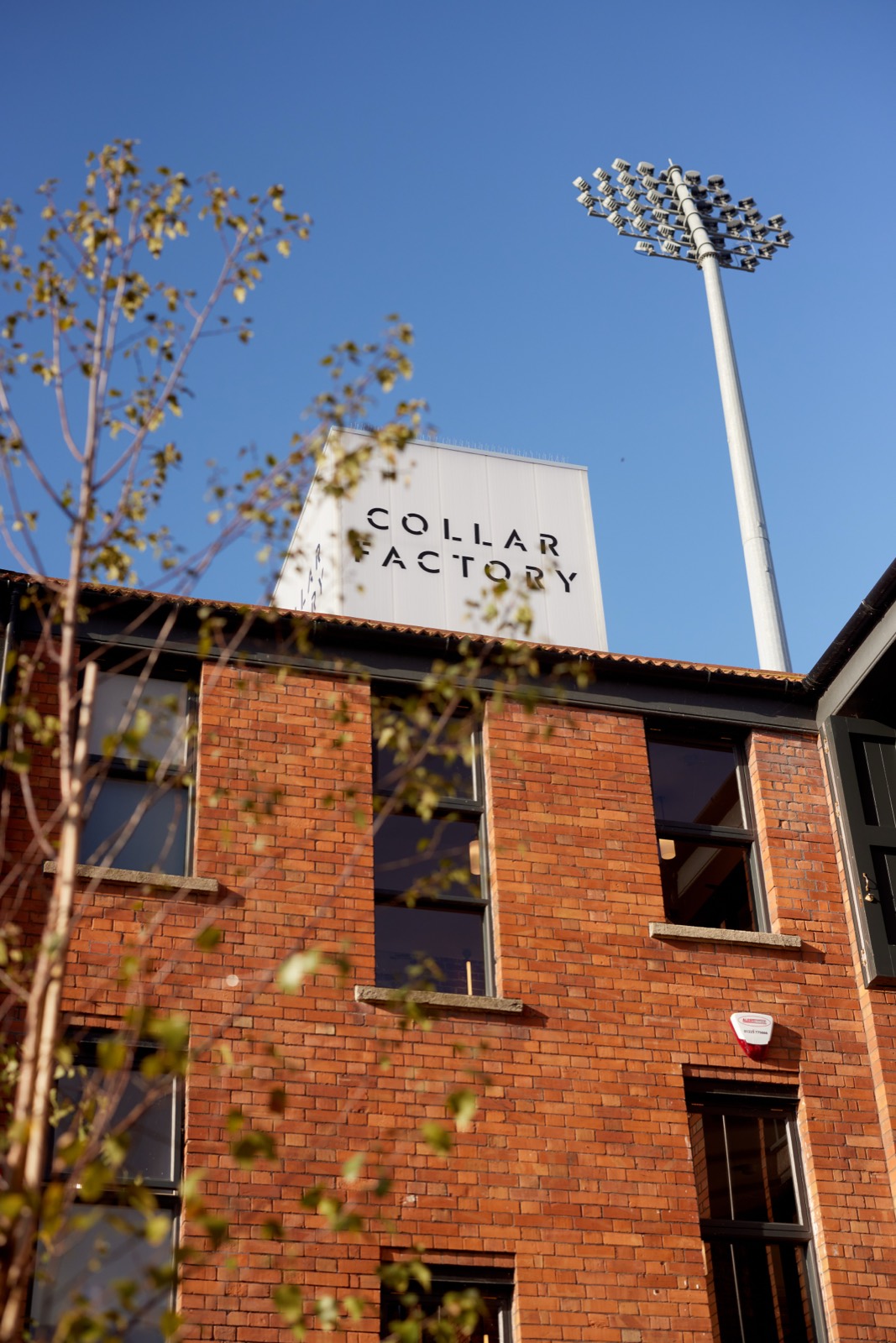 The collar factory tower with its painted sign