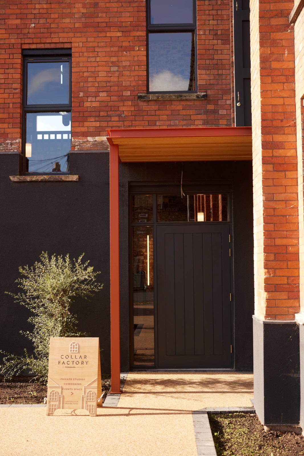 The entrance beneath the brick arch