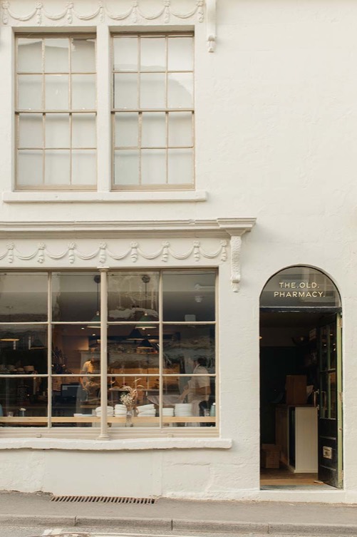 The green framed shopfront of the Old Pharmacy