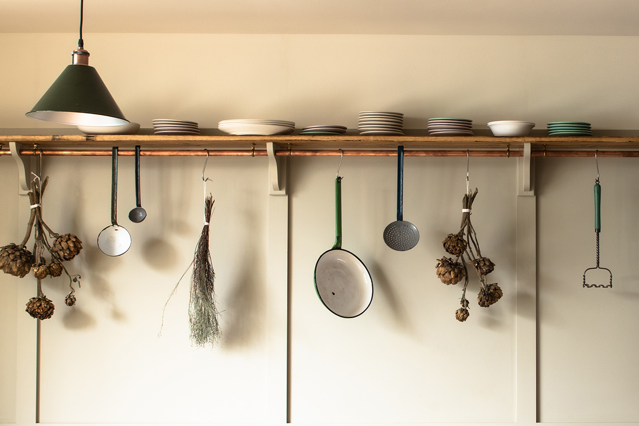 The kitchen shelves and pan rail